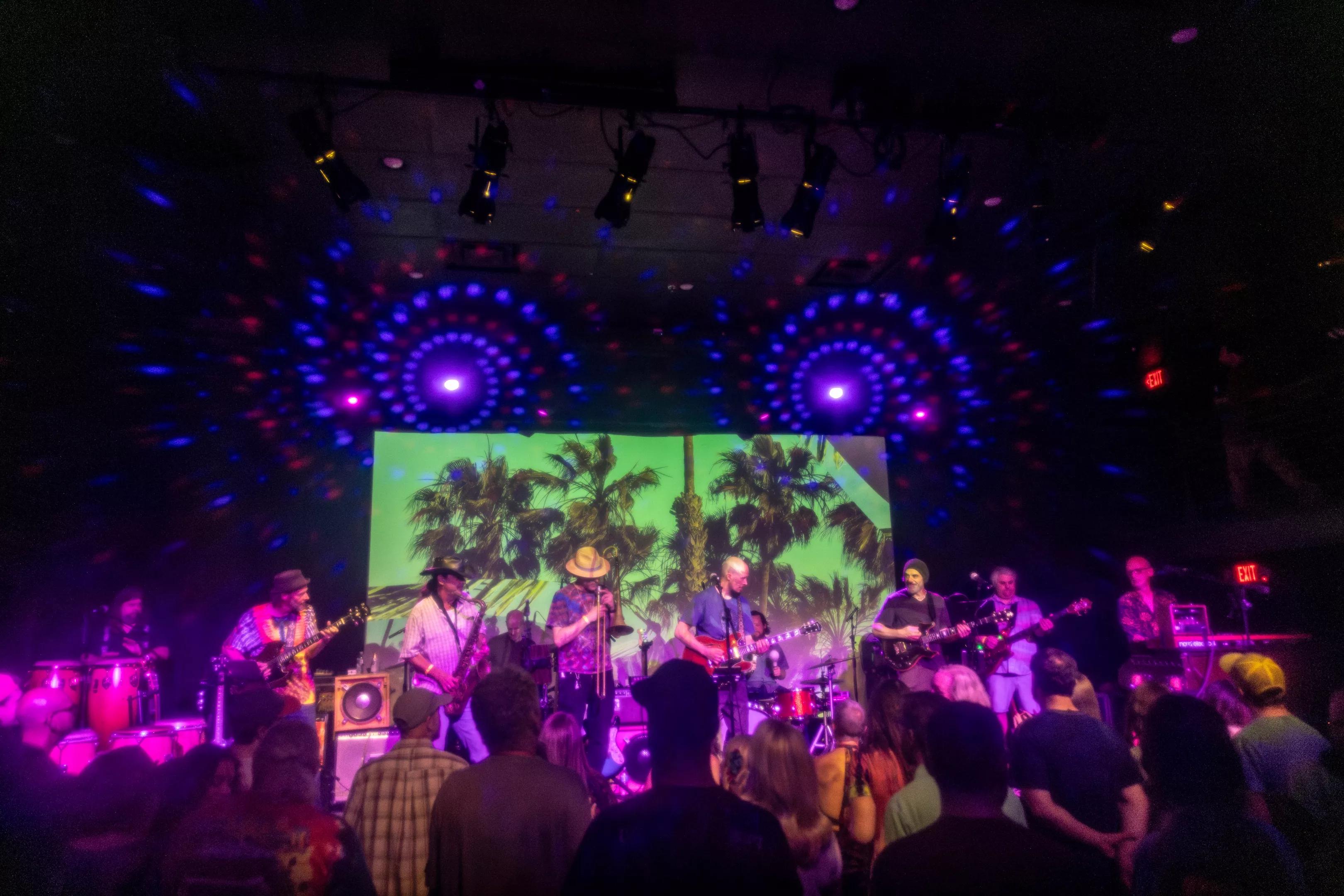 A group of musicians and band members on stage