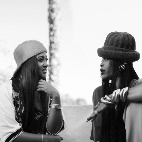 Two women in conversation sitting outside