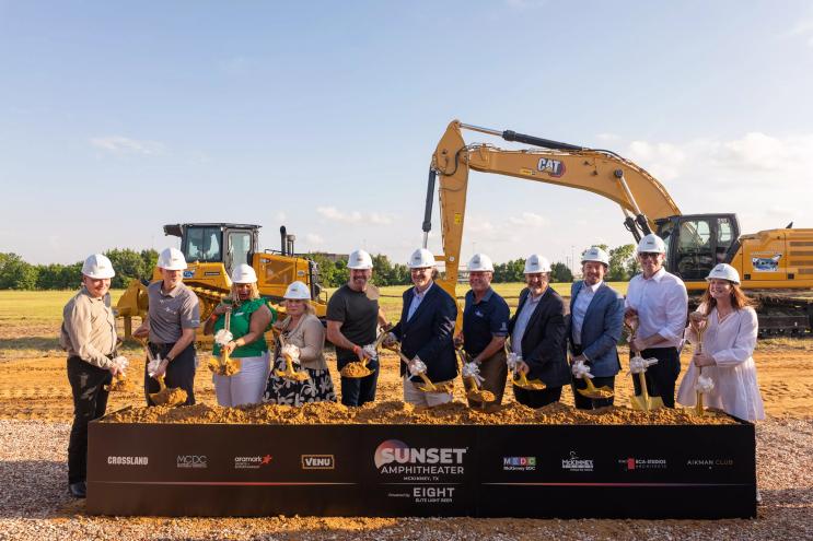 A group of people in front of dirt