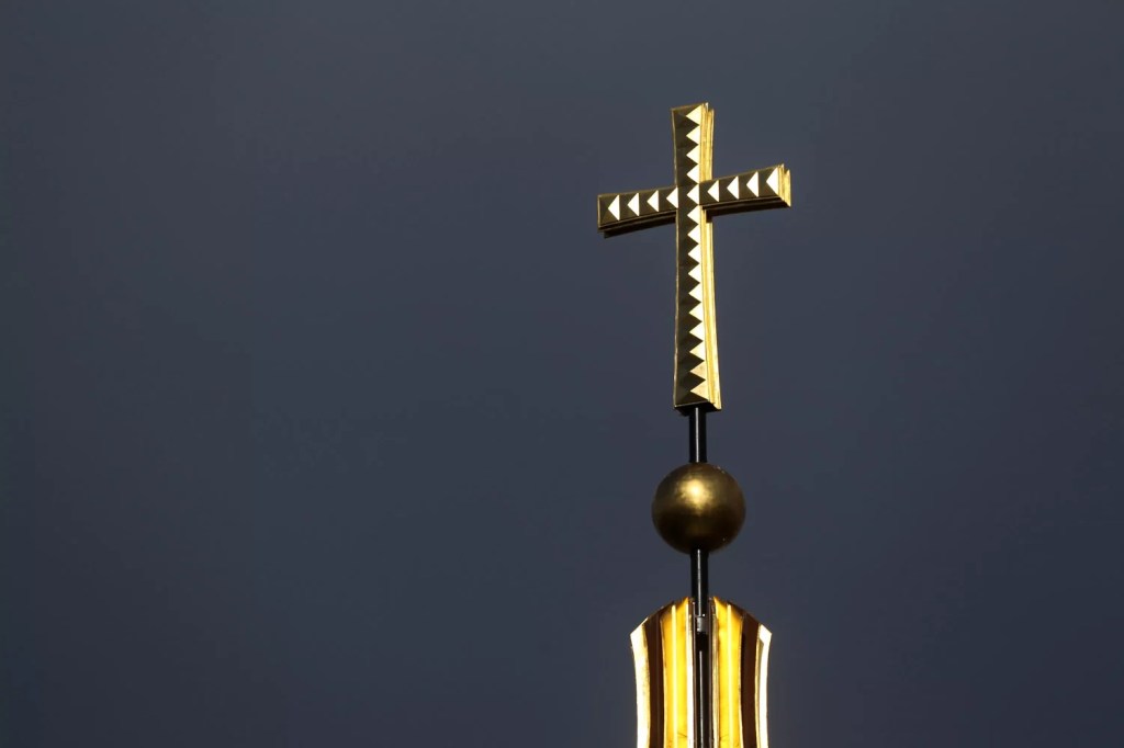 Church cross on top of a steeple