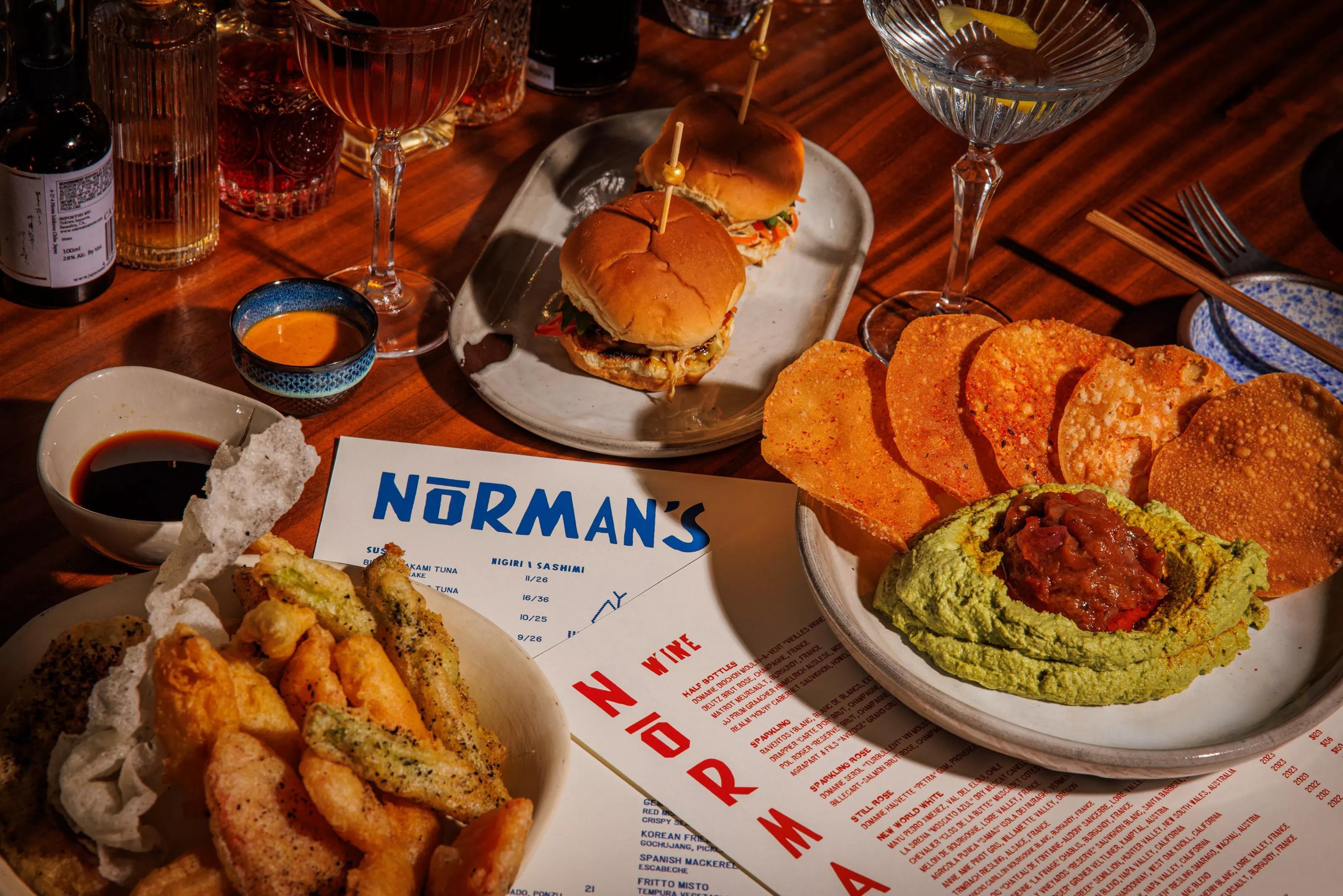 a table full of food at Norman's Japanese Grill